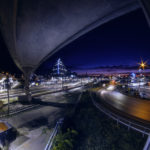 Kristiansand sett fra havneområdet med togskinner og bro i forgrunnen